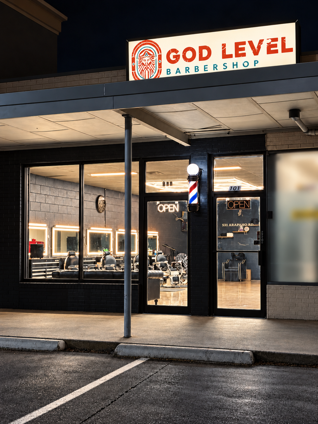 God Level Barbershop storefront with its sign and barber pole