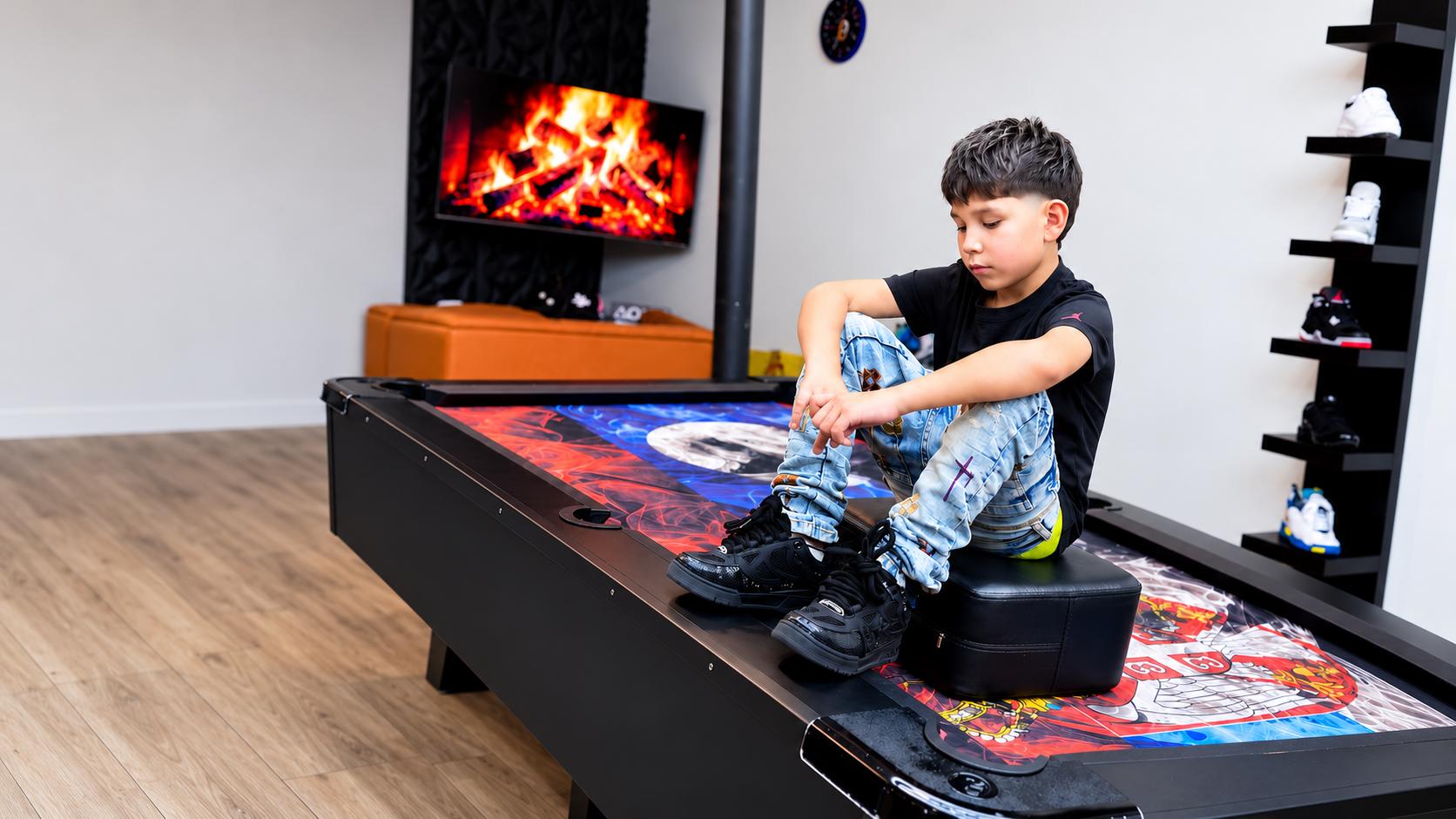 Young client with a fresh taper haircut seated on a cushion in the shop