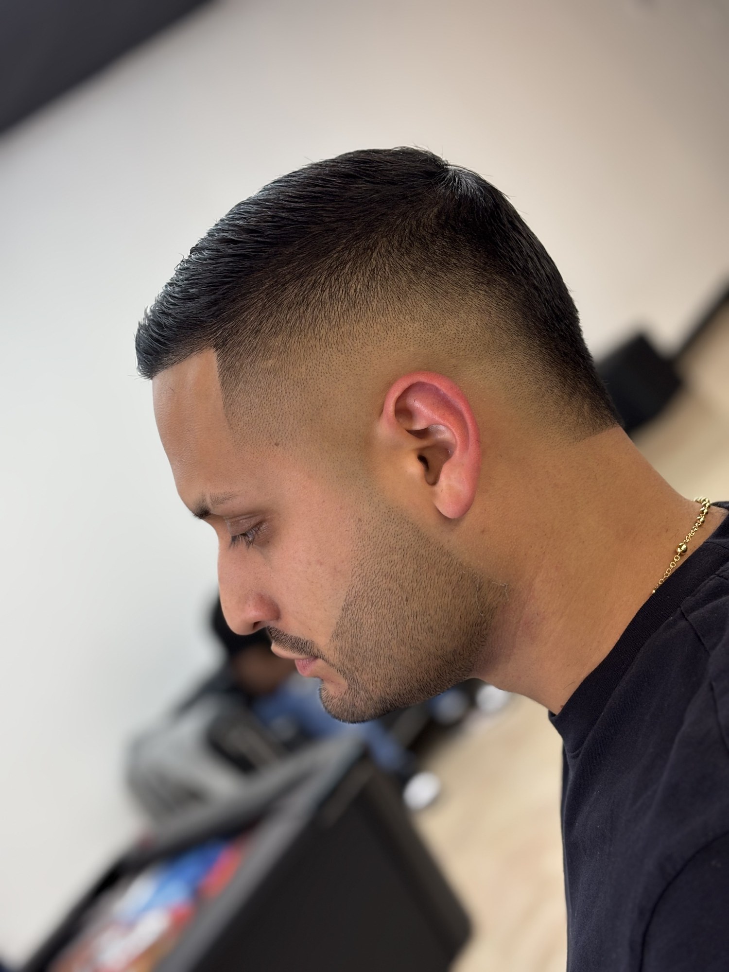 Mid Skin Fade haircut by Jhoel at God Level Barbershop