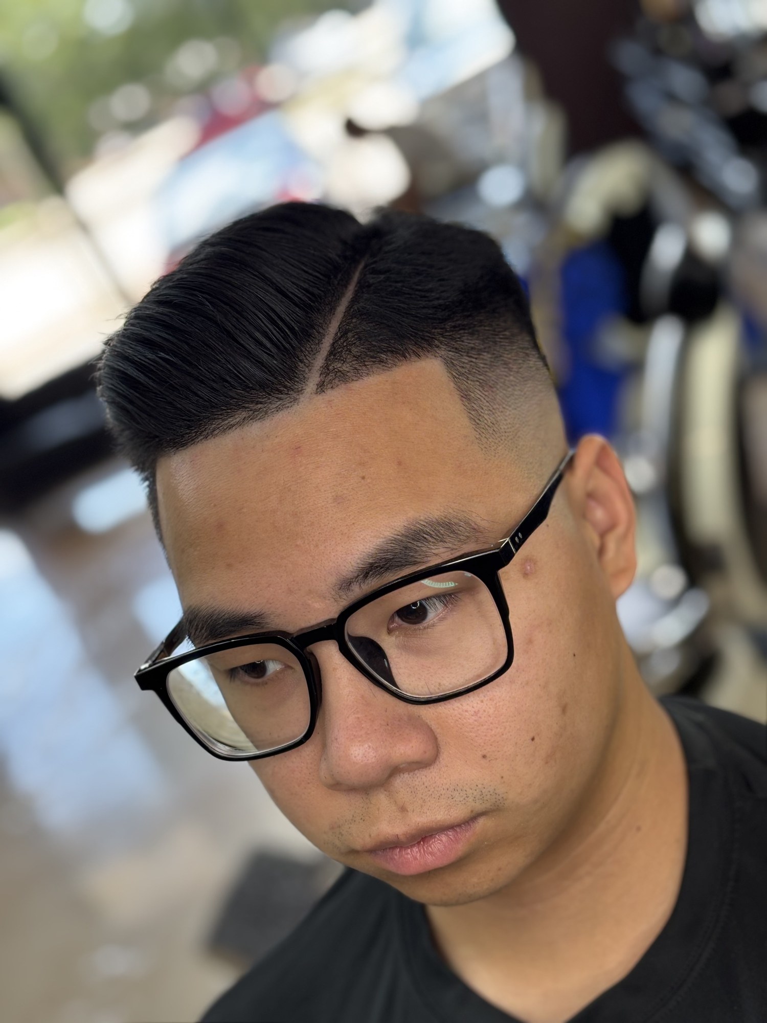 Hard Part Taper haircut by Jhoel at God Level Barbershop