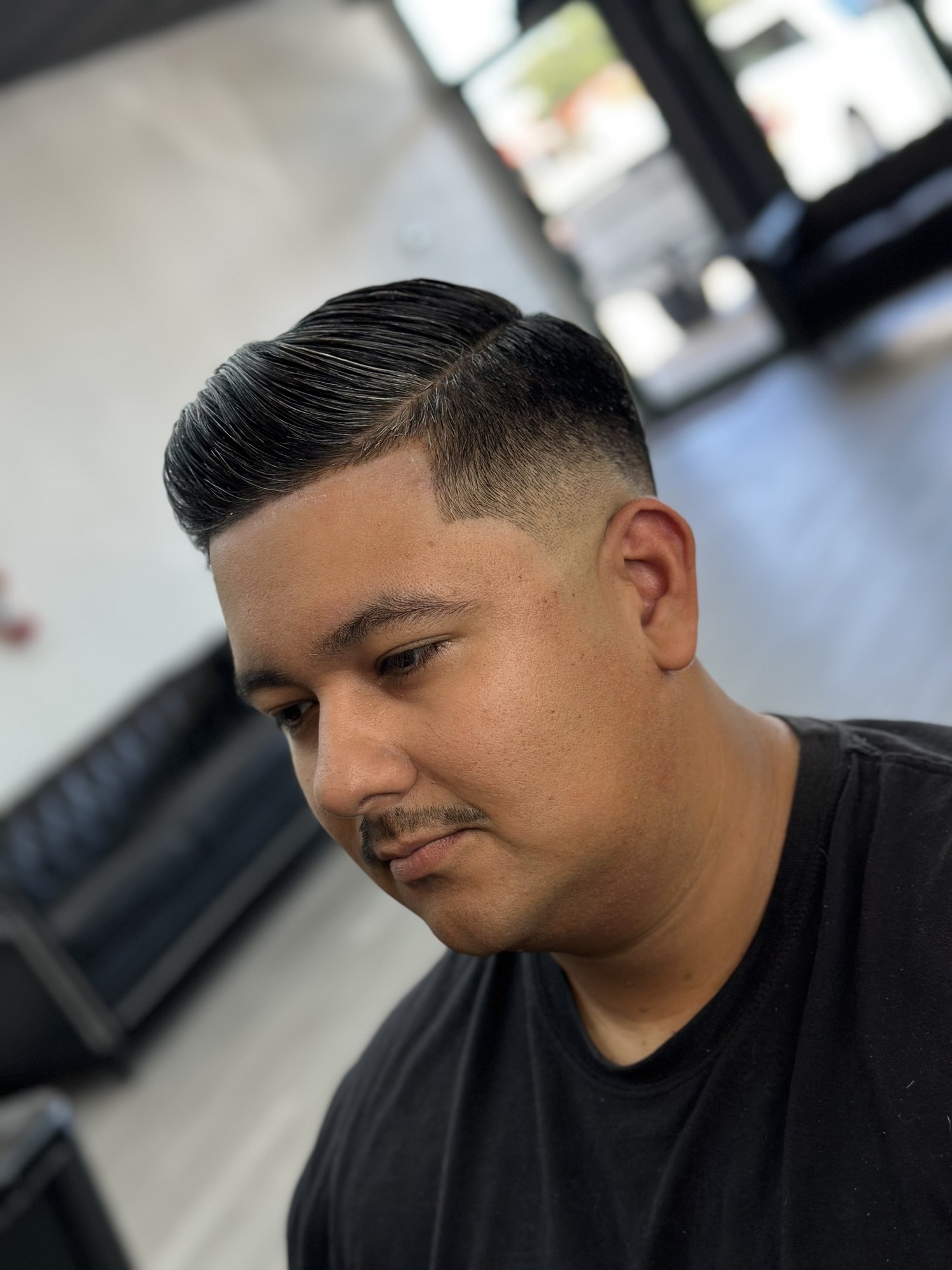 Comb Over Fade haircut by Jhoel at God Level Barbershop